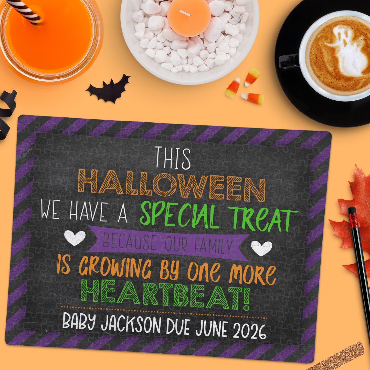 A Halloween-themed sign announces a pregnancy, stating, "Baby Jackson due June 2026," surrounded by festive drinks and decorations.
