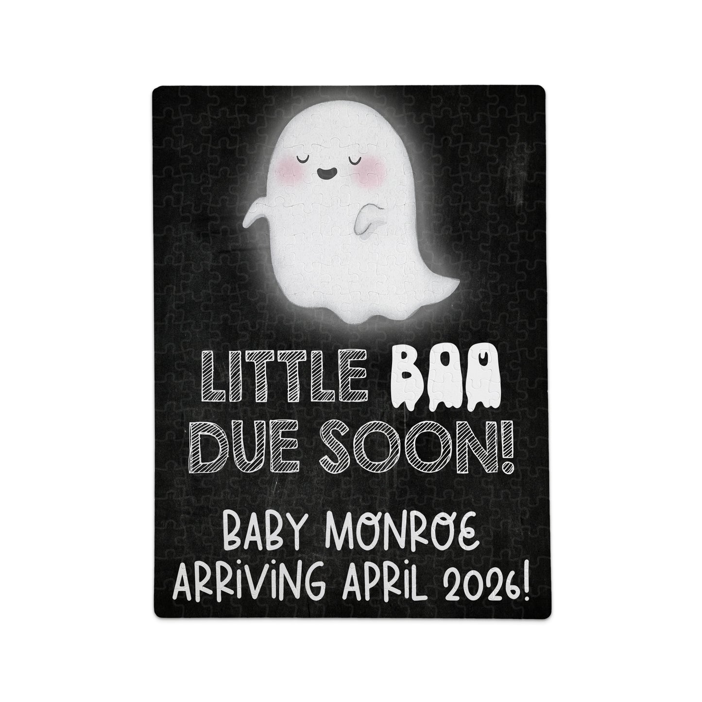 A puzzle with a cartoon ghost and the text: "Little Boo Due Soon! Baby Monroe Arriving April 2026!" on a black background.