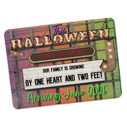Colorful sign-style announcement card reads: "This Halloween Can't Be Beat. Our Family Is Growing By One Heart And Two Feet. Arriving June 2024.