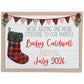 A holiday-themed puzzle announces, "We're adding one more stocking to our mantel! Baby Caldwell arriving July 2026," with a plaid stocking and festive decorations.