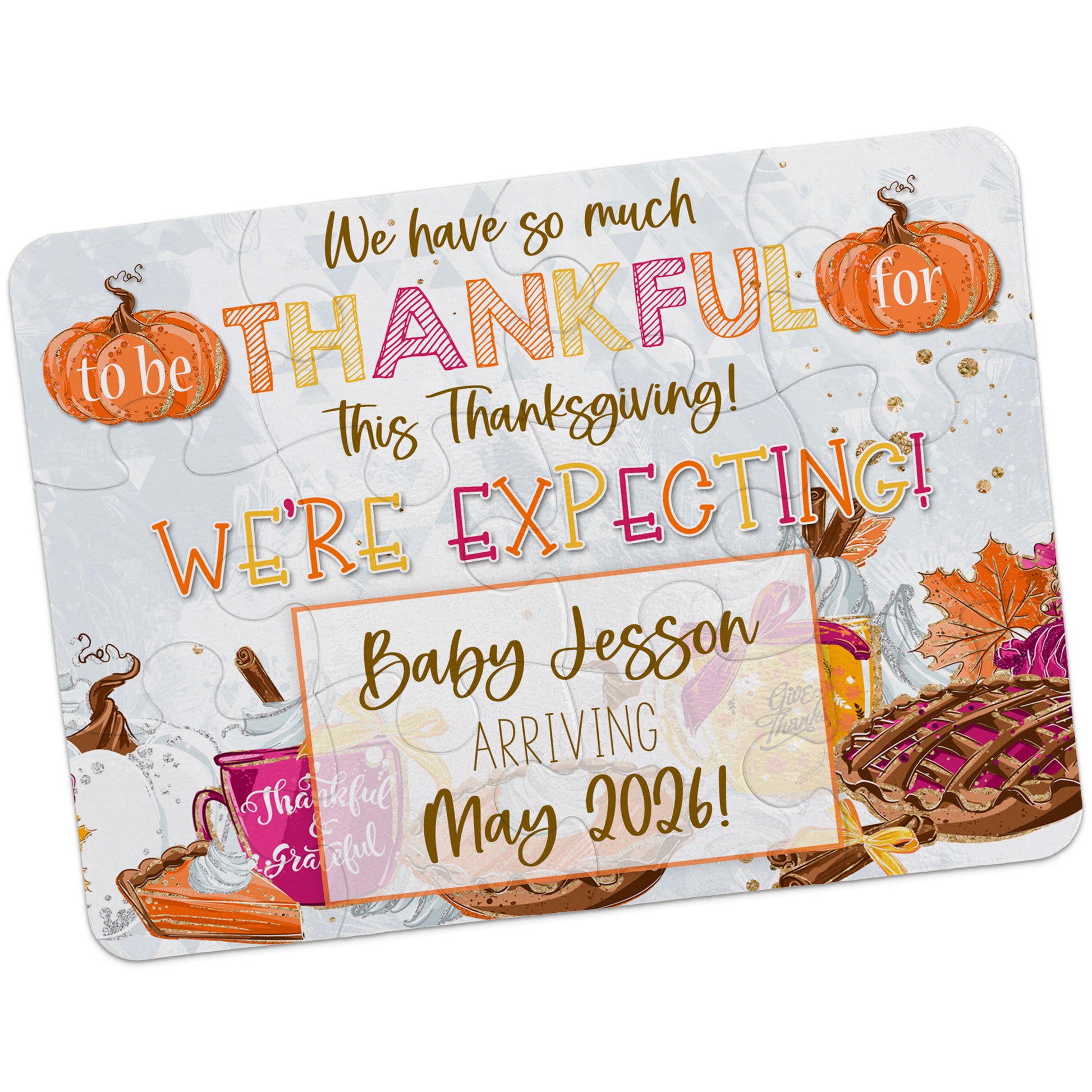 A Thanksgiving-themed card with pumpkins, pie, leaves, and food, announcing a pregnancy: "We're expecting! Baby Jesson arriving May 2026!.