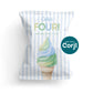 A party favor bag with blue and white stripes features an illustration of a pastel ice cream cone and text reading "Cole's FOUR! Birthday Party Favor.